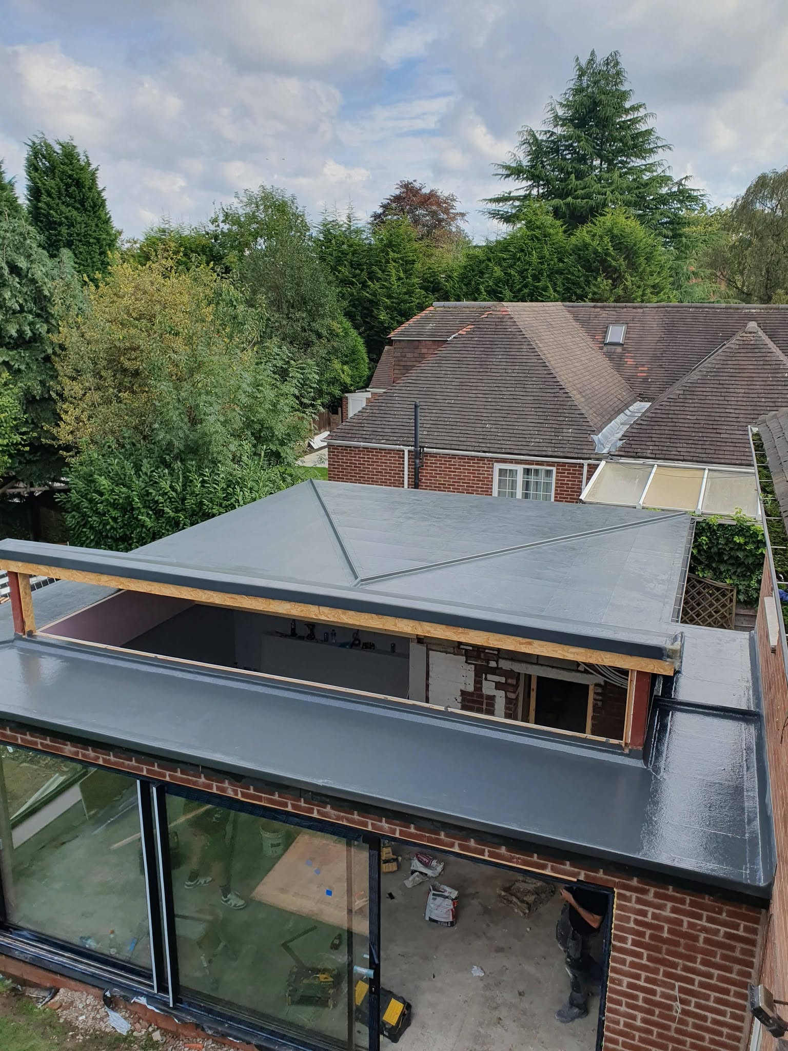 GRP fibreglass flat roof on a glazed extension