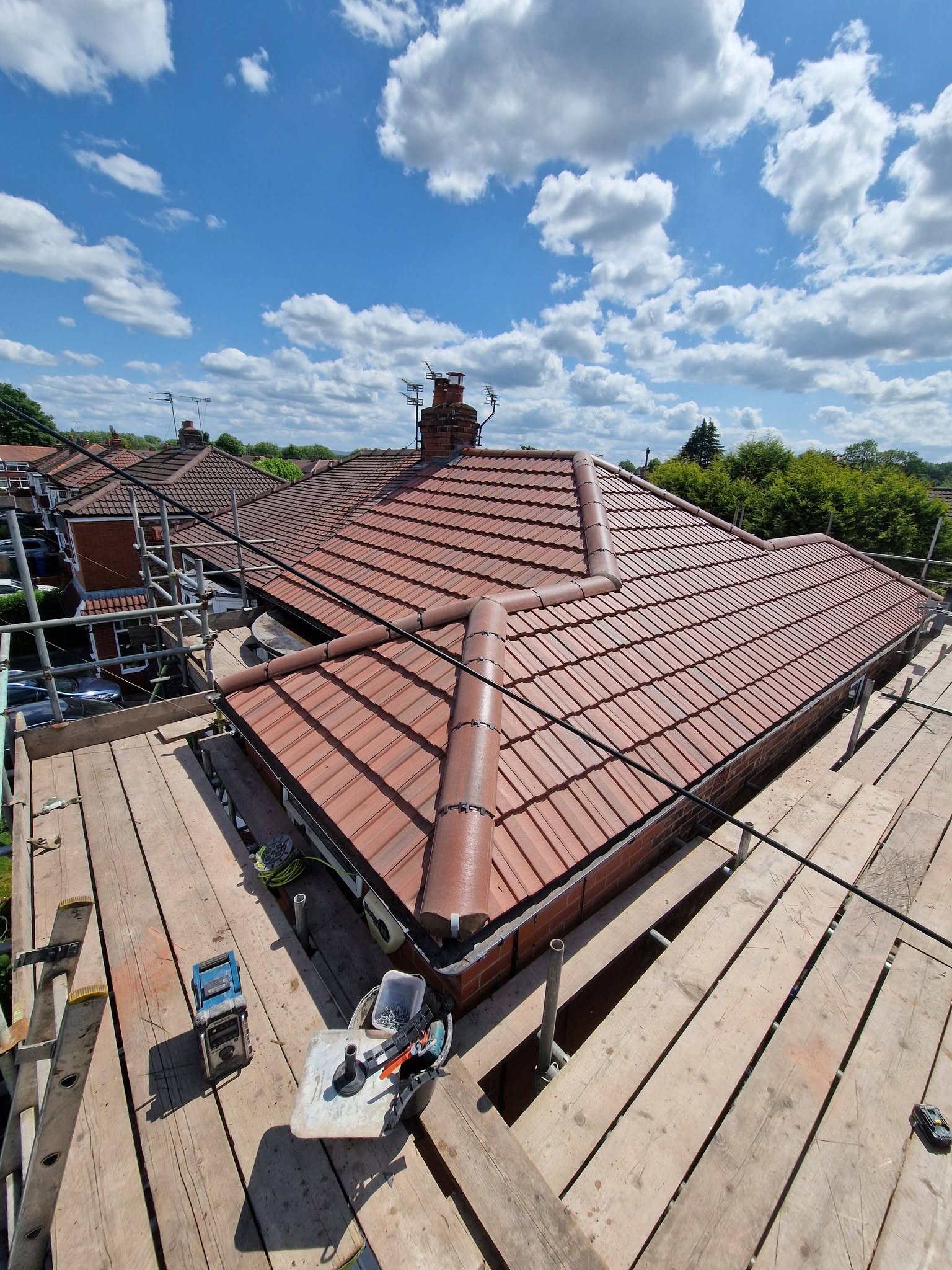 Full re-roof in red concrete tile