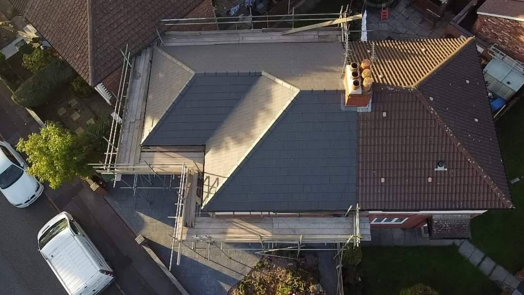 Full re-roof in progress with scaffold